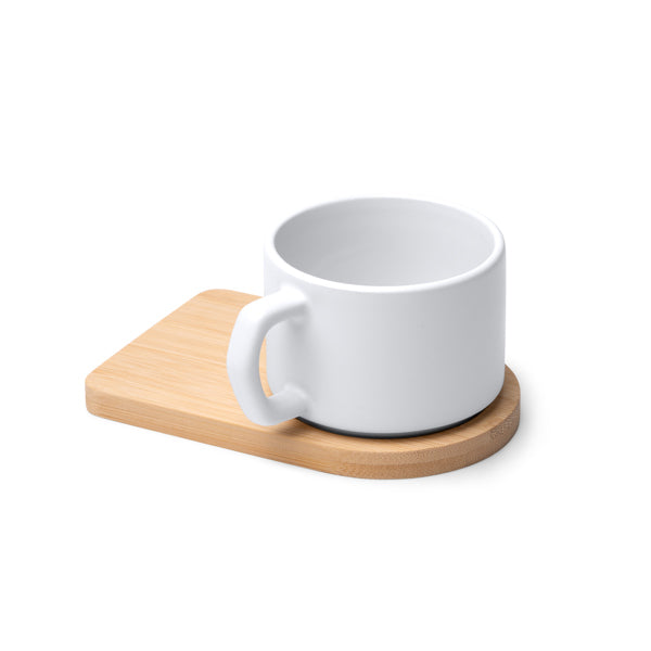 Tazza in ceramica con finitura esterna opaca, manico dal design irregolare e base in bambù. Capacità 180 ml,sublimatica